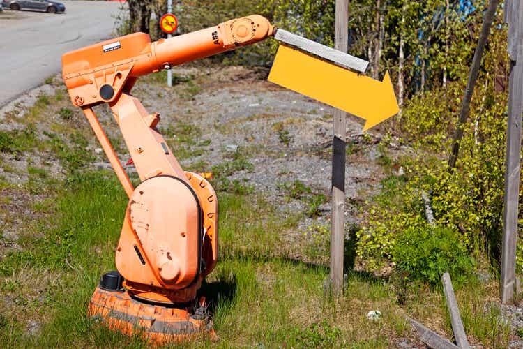 Umea, Norrland Sweden - May 15, 2021: abandoned industrial robot that gets to work as a sign pointer