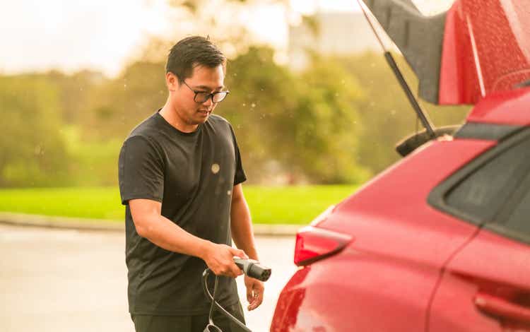 Plugging a Charger into Car.