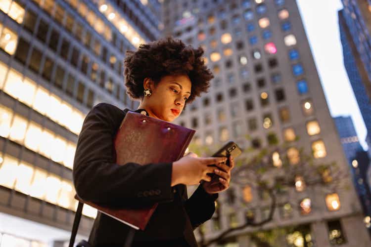 Shining in the Night: Black Businesswoman Embracing Success on Wall Street