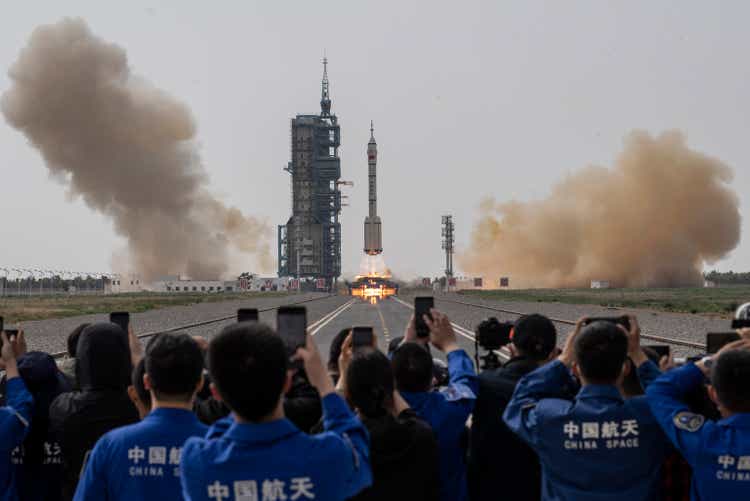 China sends first civilian into space, eyes moon landing by 2030