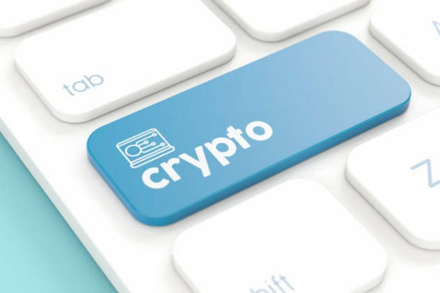 Blue Crypto Key on Computer Keyboard