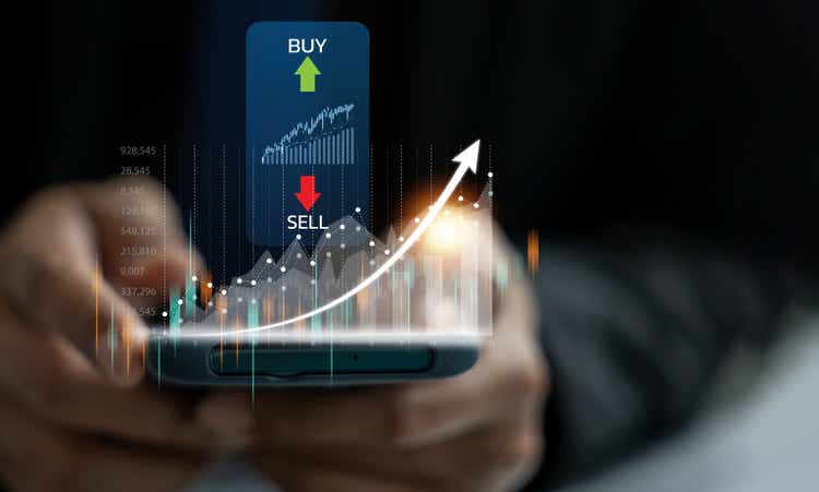 Man monitoring stock market trends and trading activities