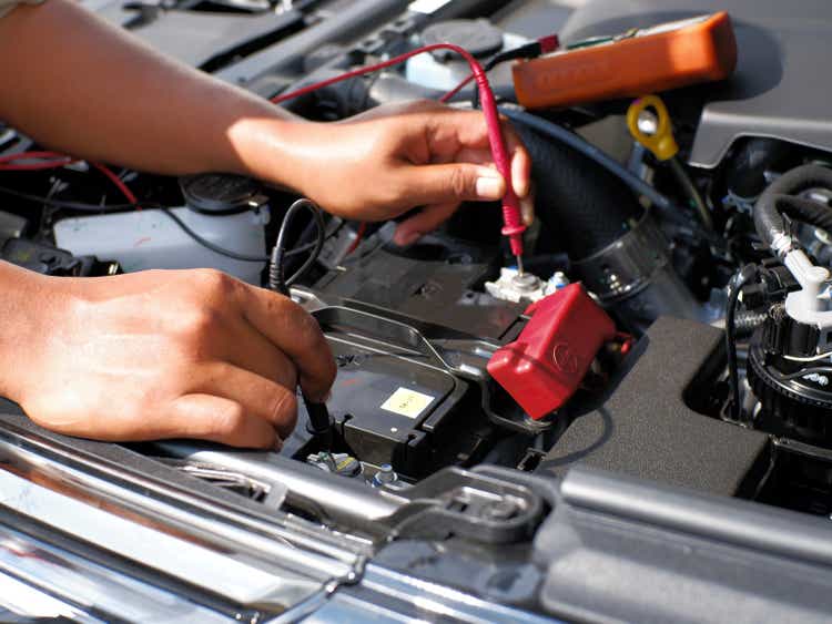 The mechanic checks the condition of the car battery life by using the battery voltage or multitester