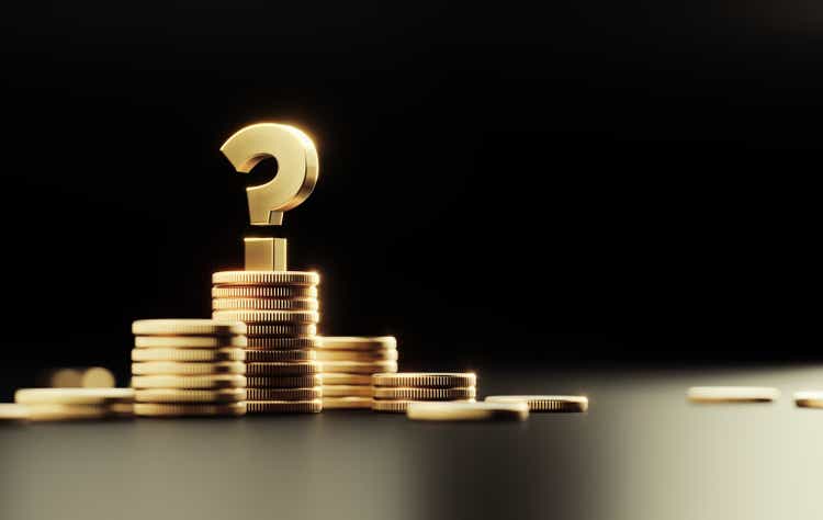 Gold Colored Question Mark On Top Of Coin Stacks Before Black Background
