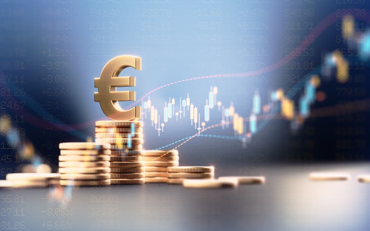 Euro Symbol On Top Of Coin Stacks Before Blue Financial Graph