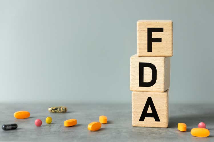 FDA, words on wooden blocks. Beautiful gray background, business concept, Confirmation of inspection and registration of drugs and medical devices used in medicine, copy space