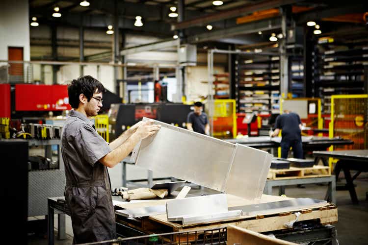 Steel worker inspecting completed product