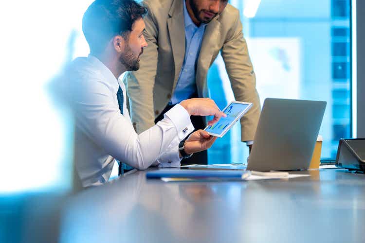 2 business men working in the office.