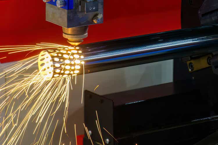 Close up scene the fiber laser cutting machine cutting machine cut the stainless steel tube.