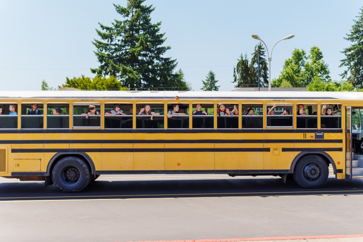 Excited school children on school bus