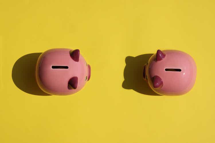 Piggy bank on yellow background