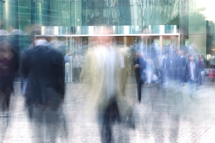 Blurred Business People Entering and Leaving Office Building