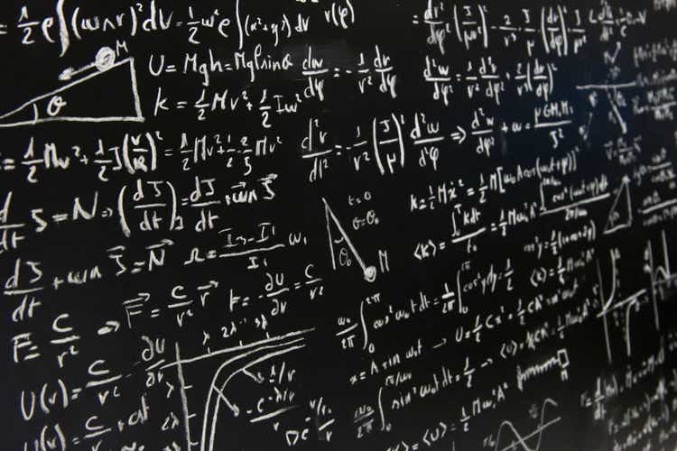 blackboard full of equations