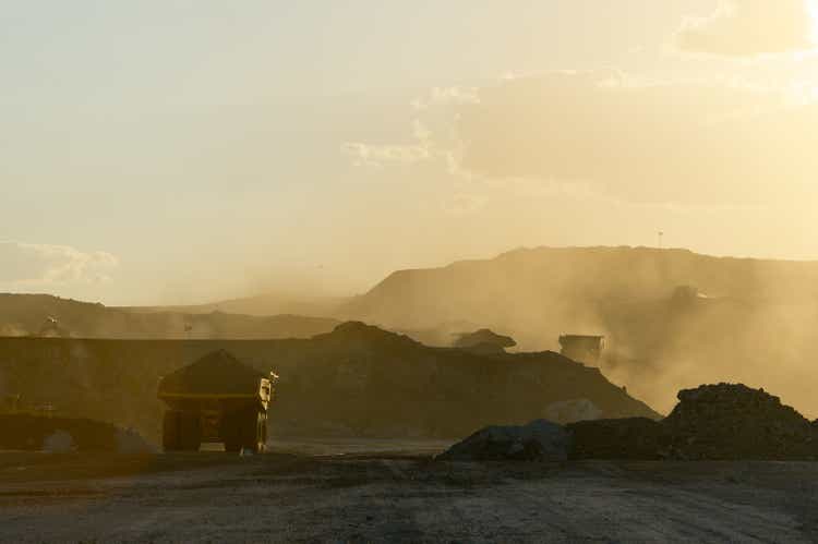 Coal mining truck hauling dirt on a hazy day