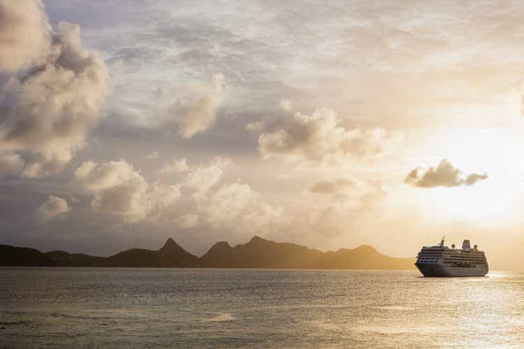 Sunset over the sea with a cruise ship in Grenadines