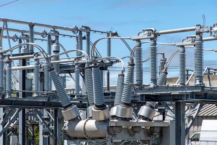 High-voltage bushings on a utility transformer at an electrical substation