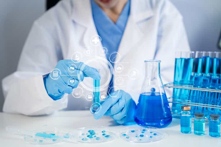 Lab work, Doctor holds a test tube takes the test from a test tube in analysis, blood, DNA, test tube stand.