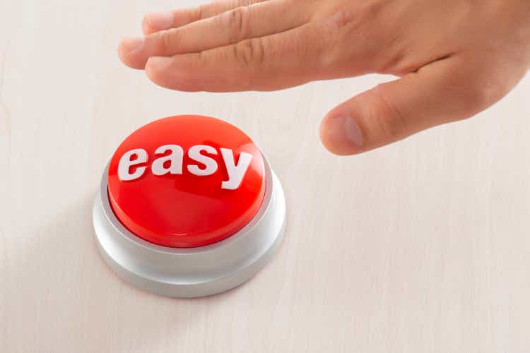 Man Reaching Easy Button