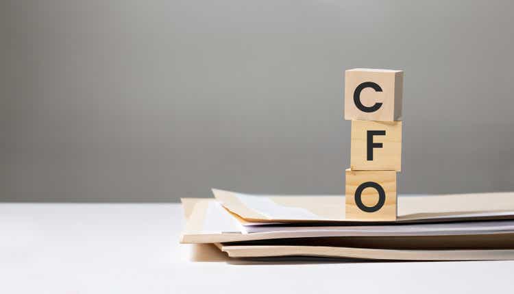 CFO Chief Financial Officer on wooden cube over documents