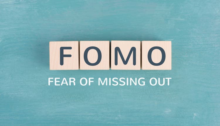 FOMO acronym for fear of missing out, social media and lifestyle concept, regret and depression, state of mind