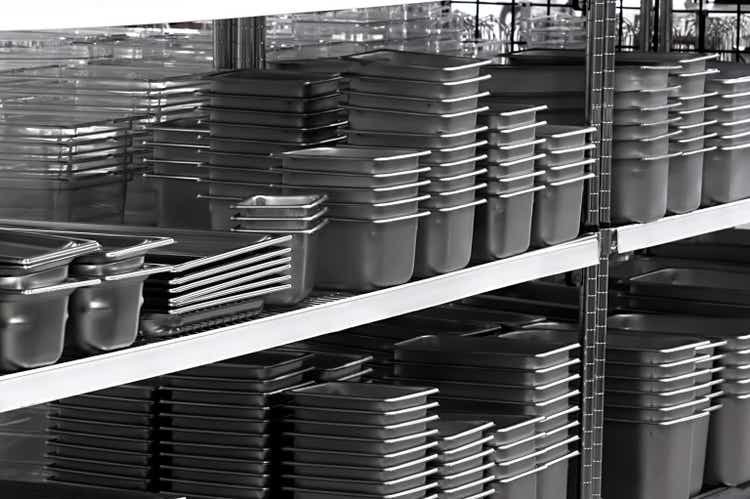 Several stacks of stainless steel pans