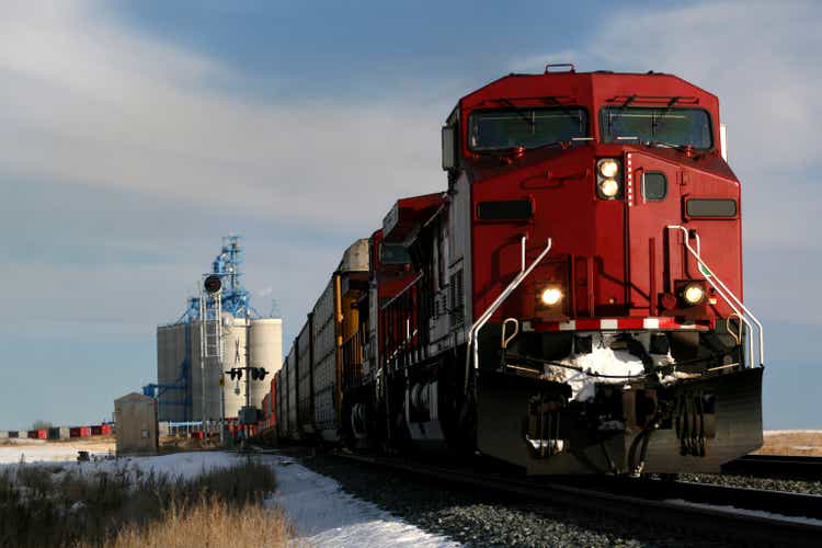 Red train on tracks in Alberta, Canada