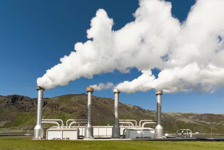 4 steel chimneys with smoke from geothermal energy
