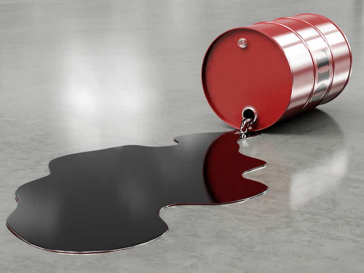 Oil spilling from red barrel onto floor