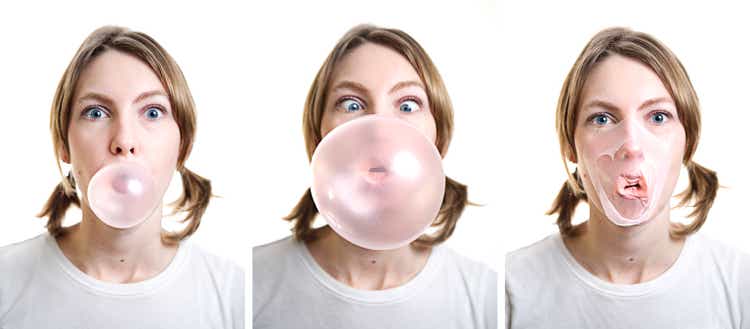 Girl Blowing Bubble Gum which Pops on Her Face