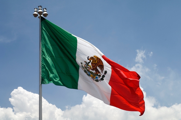 Flag of Mexico with blue sky