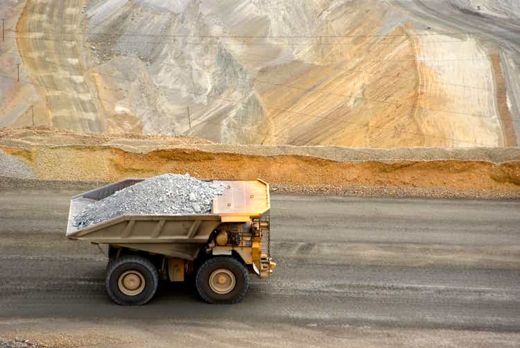 View from above of a large yellow dump truck at a Utah copper mine