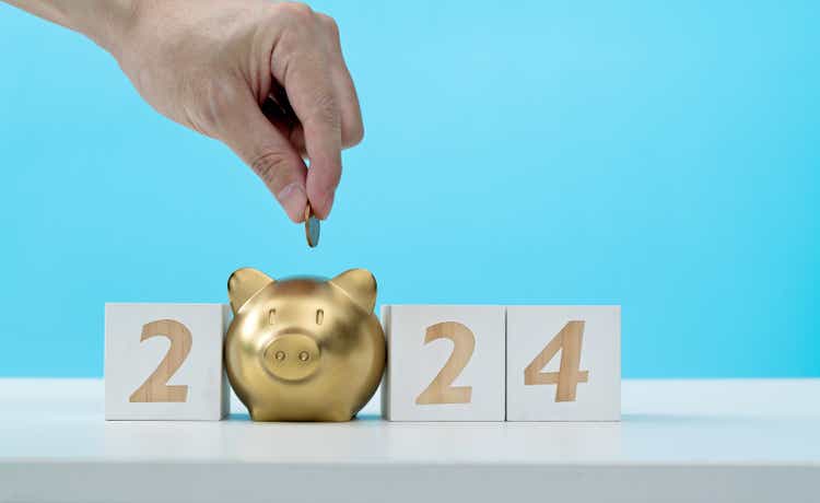 New Year 2024 and piggy bank on the table