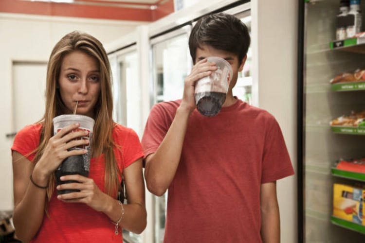 Couple drinking soda