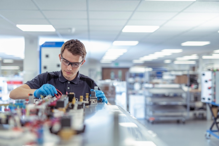 Apprentice engineer in medical electronics machinery manufacturing factory