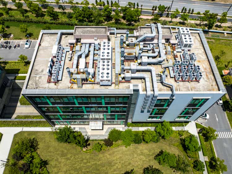 Elevated view of industrial air conditioning units from a roof