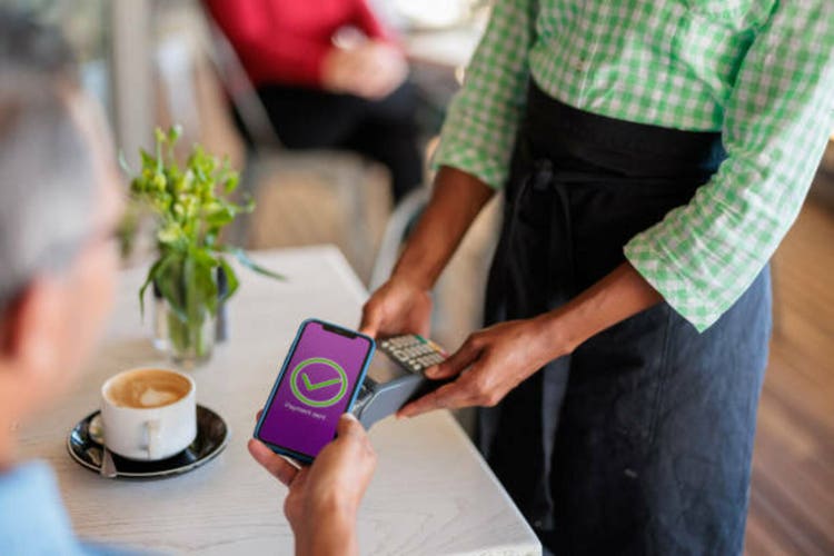 Customer pays coffee with a banking application