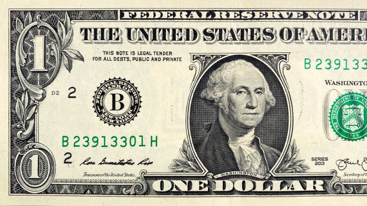 A close-up of a part of a $1 bill. View from above. One US dollar. The American national currency. Economics and finance. Cash banknotes.