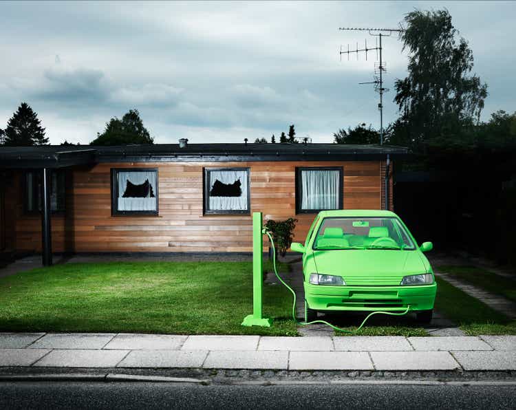 Green car, sustainable energy. (Charging)