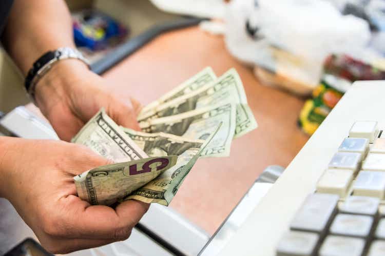 Store cashier counting the cash