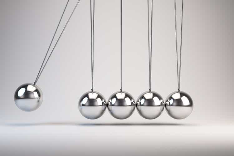 Silver balls of Newton"s cradle swing back and forth