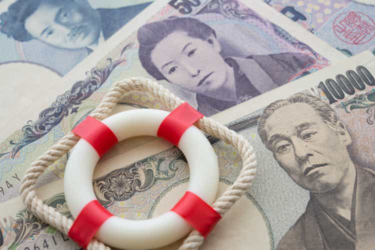 Lifebelt on Japanese yen paper banknote bill background.