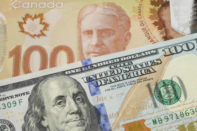 US 100 Dollar and Canadian 100 Dollar Banknotes - Currency Exchange
