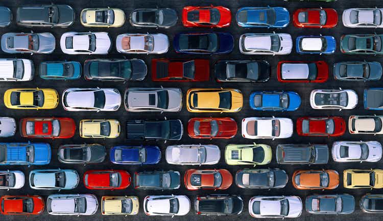 A traffic jam during rush hour, vehicles lined up in rows, top view.