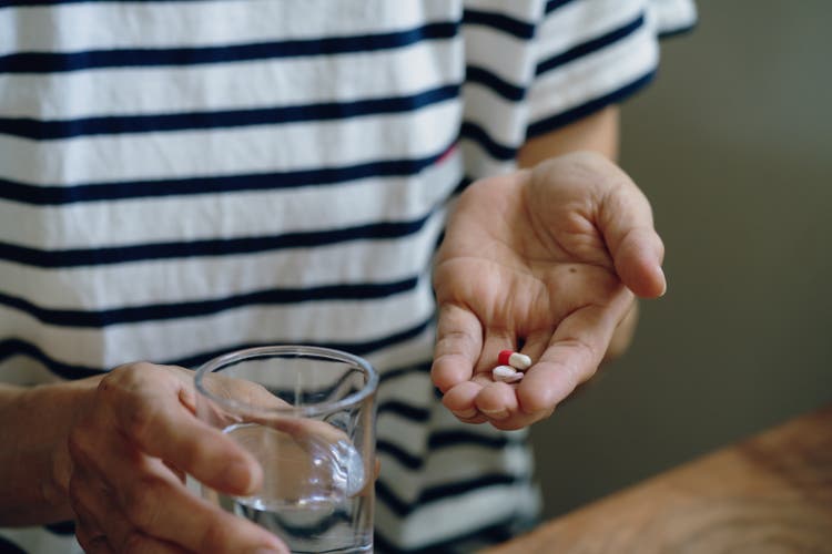 Senior woman taking medicine