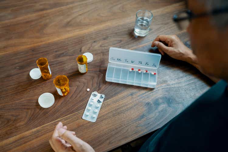 Senior man taking various medications