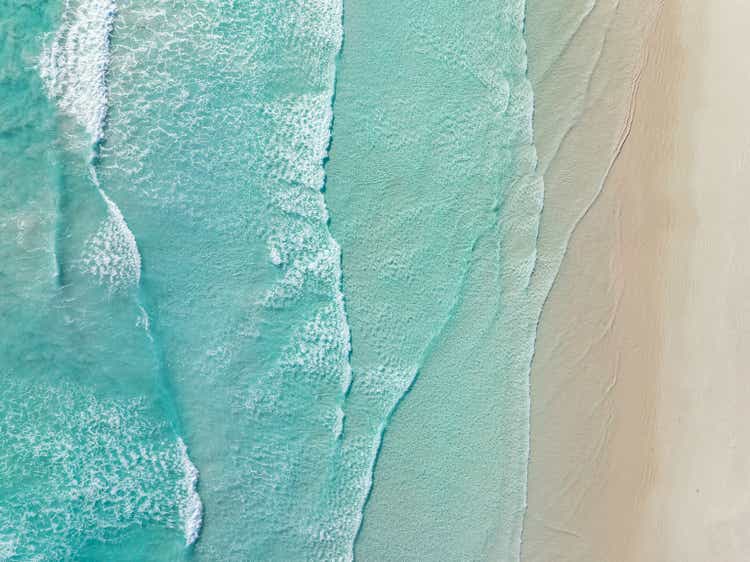 Waves from the Southern Ocean washing onto a beach shot from a drone perspective, Esperance, Western Australia, Australia