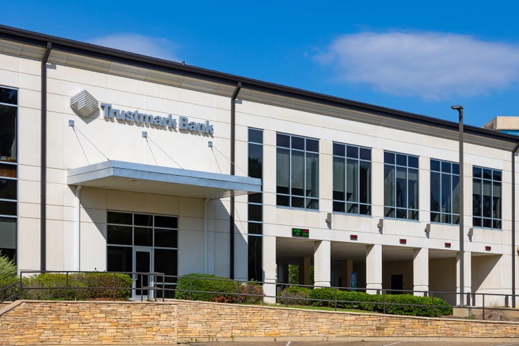 Trustmark bank building with sign and logo.