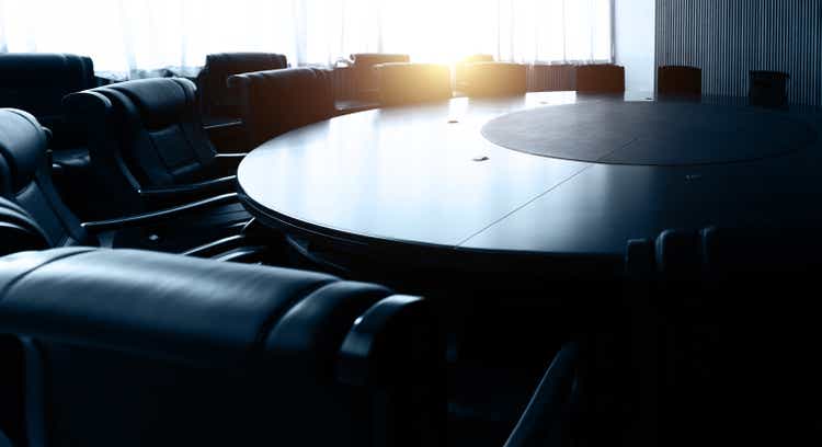 Conference table and chairs in empty meeting room