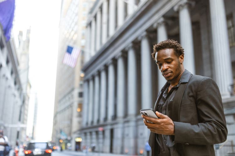 Businessman rushing to the office in Wall Street