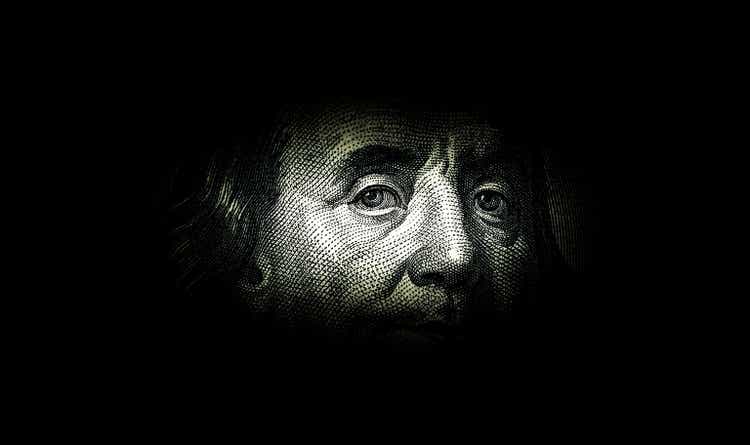 Ben Franklin"s face on the old US $100 dollar bill. Macro grunge style photo. Large resolution, large size, high quality.